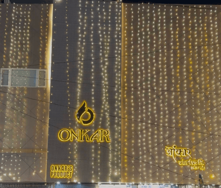 Onkar Jewellers showroom front lit with golden lights, Rohini